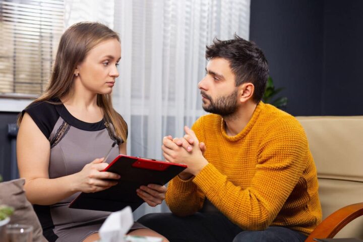 woman counseling a Caucasian man - southeastaddiction.com