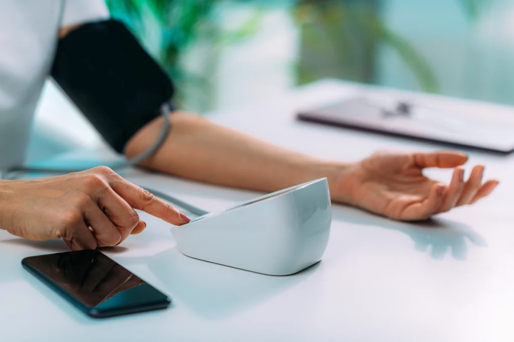 Does Adderall Raise Your Blood Pressure: A person testing their blood pressure.