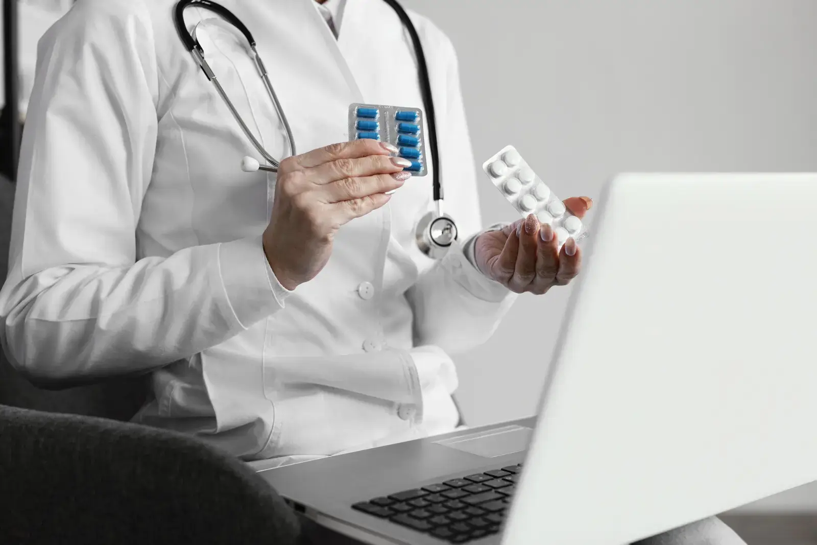 Medical professional comparing two types of prescription pills during an online consultation