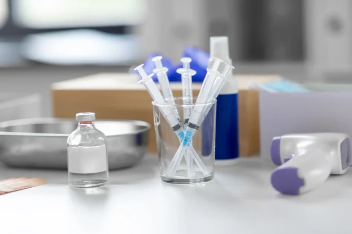 How long does ketamine stay in your system? Syringes, drug in jar and other stuff on table at hospital.